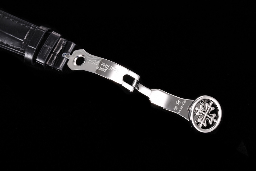 Patek Philippe folding clasp with engraved logo and leather strap detail