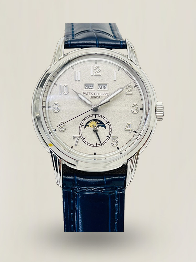 Patek Philippe watch with cream dial and blue leather strap