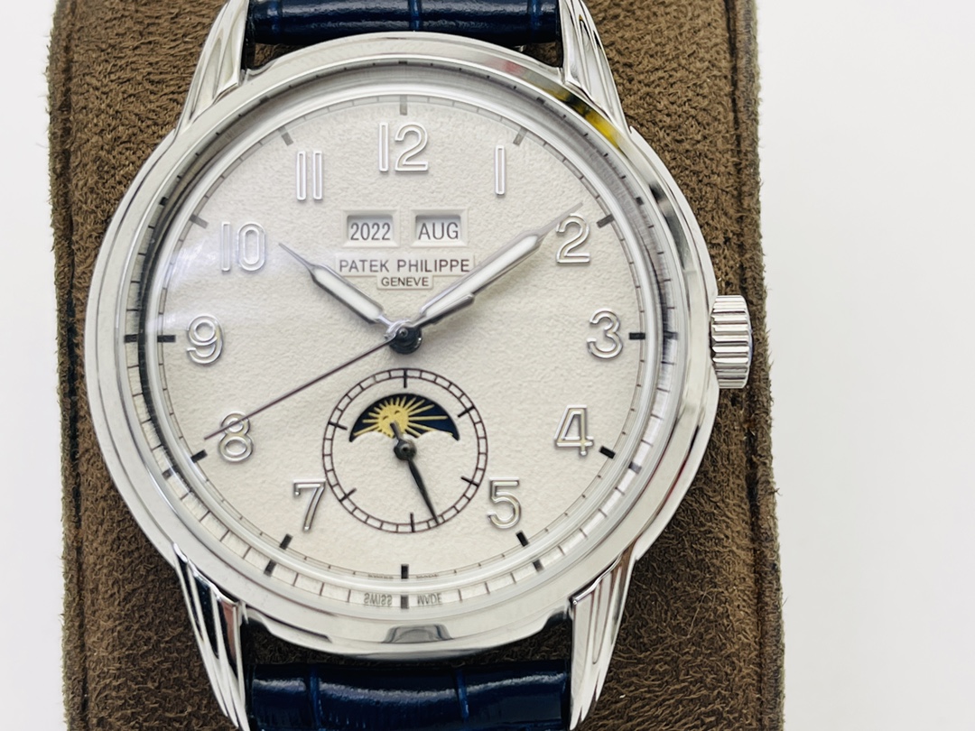 Close-up of watch dial with moonphase and date display