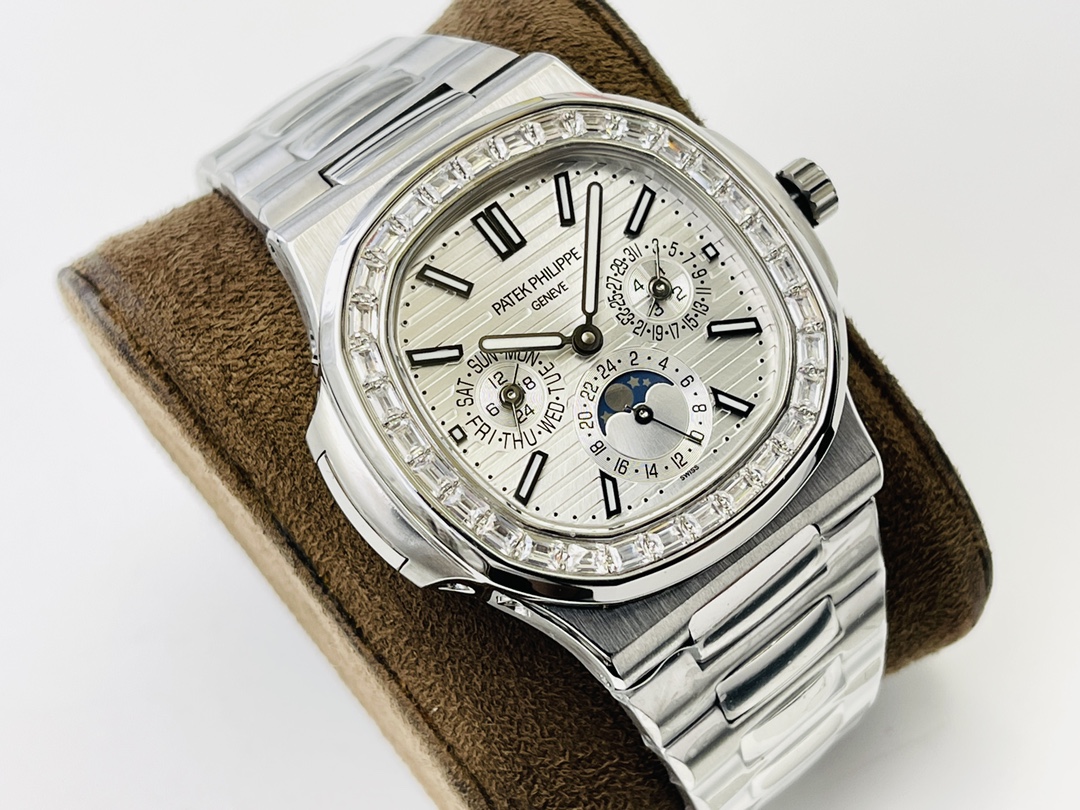 Angled view of Patek Philippe Nautilus 5740/1G-001 steel watch with diamond bezel and moonphase on suede cushion