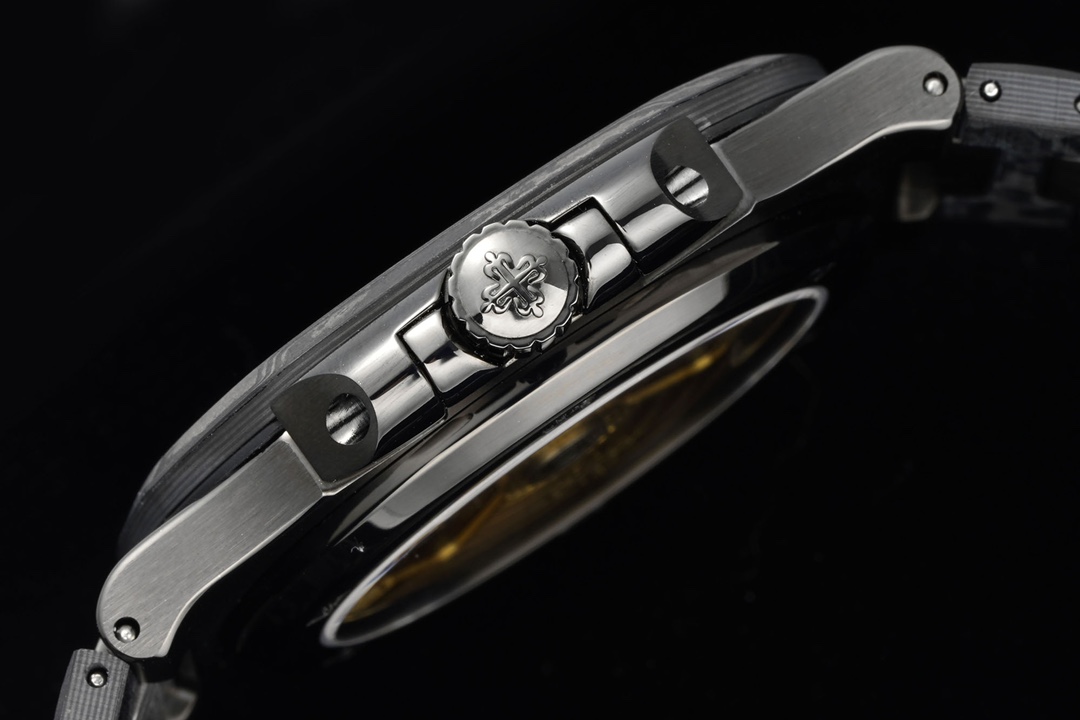 Side profile of watch case showing brushed finish and integrated bracelet links