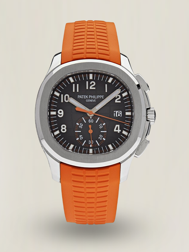 Luxury Patek Philippe Aquanaut 5968A-001 watch with black dial and orange rubber strap.
