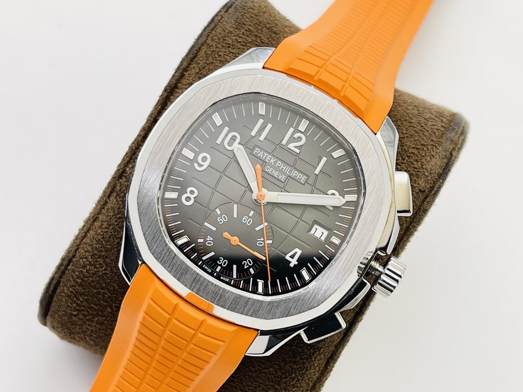 Close-up of a Patek Philippe watch with textured dial and bright orange band.