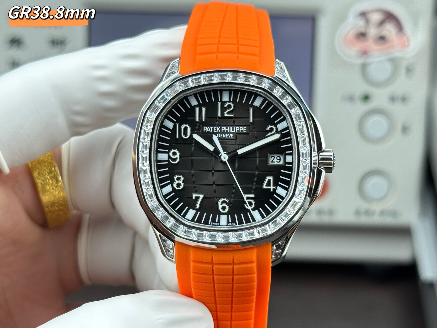 GR Factory Luxury Patek Philippe Aquanaut 5167/300G Replica Black Dial Baguette Diamond Bezel Orange Rubber Strap Watch Front View