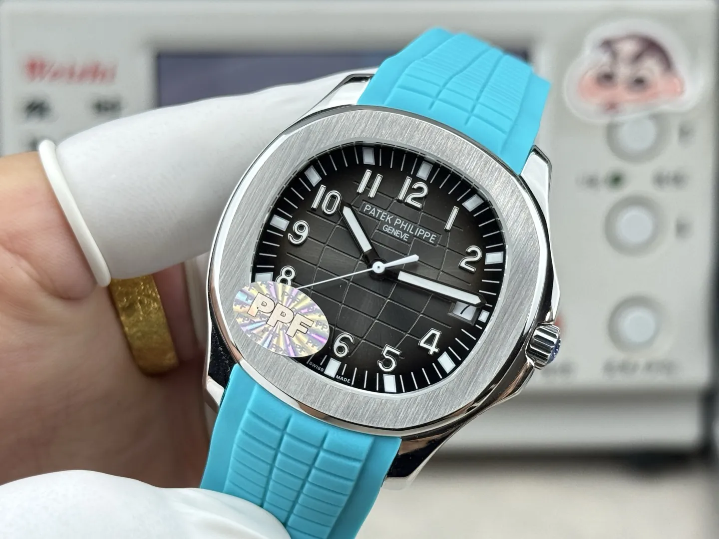 PPF Factory Patek Philippe Aquanaut 5167A Replica Sunburst Charcoal Gray Dial Tiffany Blue Rubber Strap Luxury Watch Side Profile Of The Dial 2