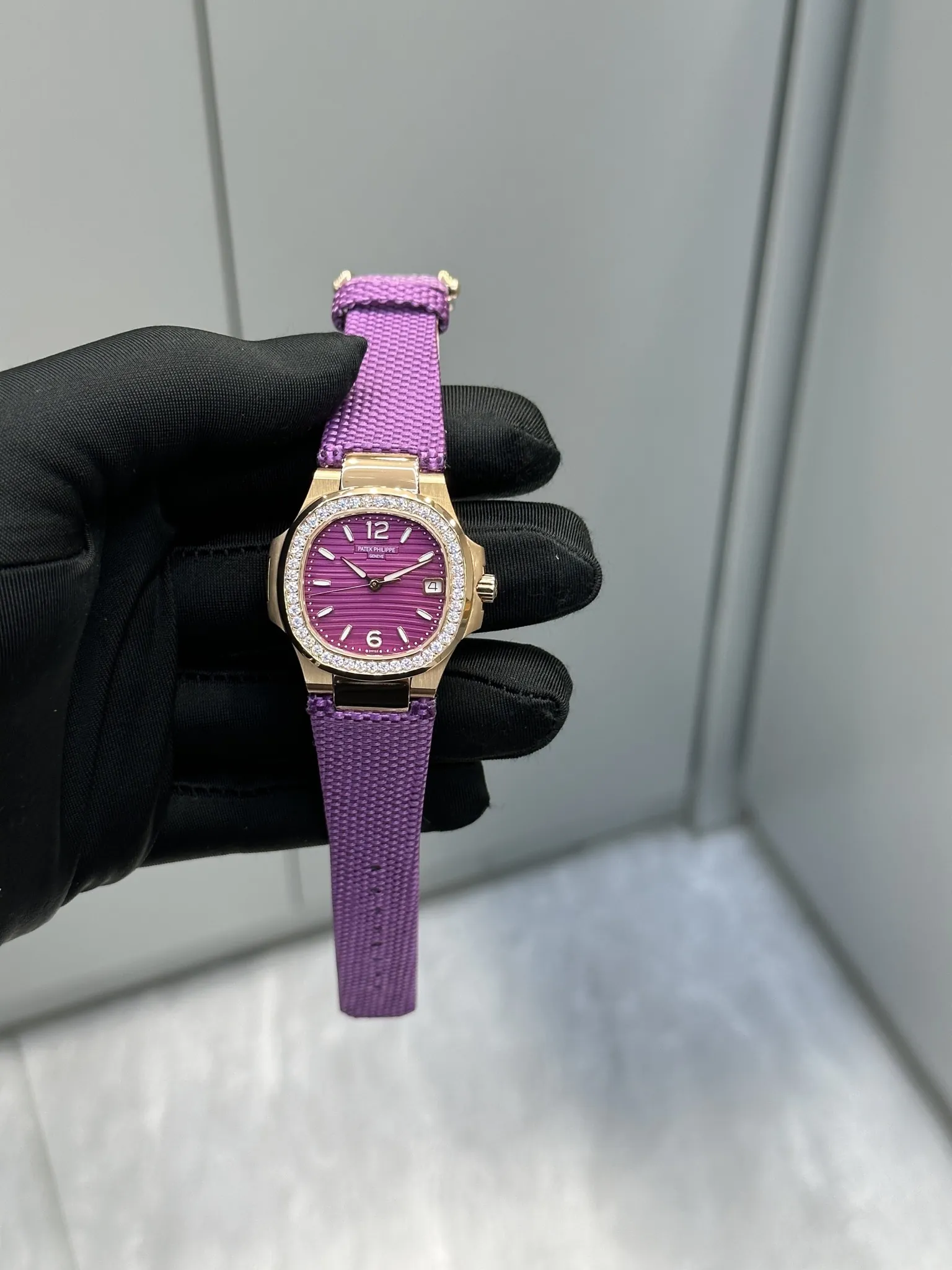 Super Clone Patek Philippe Nautilus 7010R-013 Replica 32mm Purple Wave Dial Diamond Bezel Purple Woven Strap Ladies Watch Front View